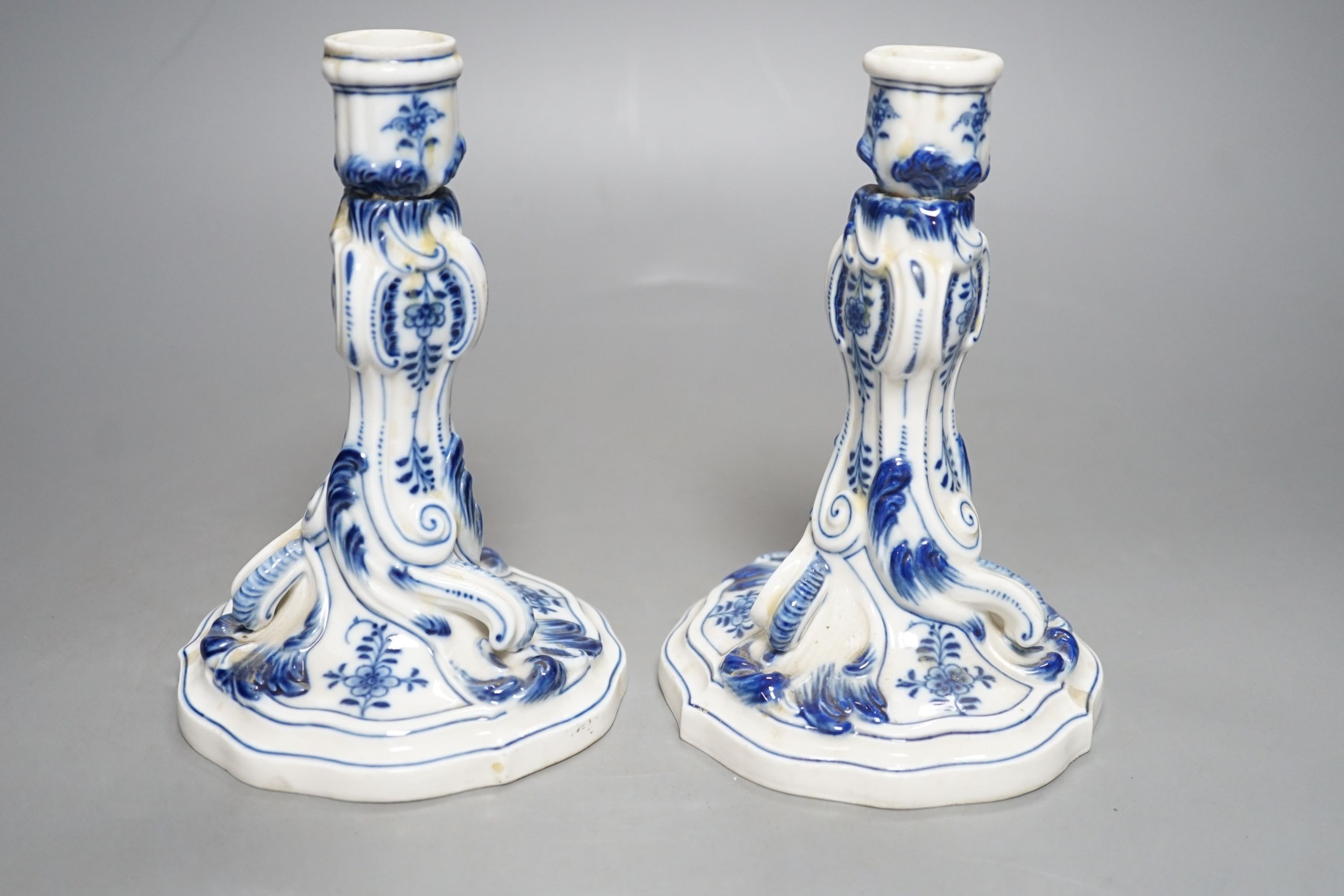 A pair of late 19th century blue and white Meissen onion pattern candlesticks - 17cm tall